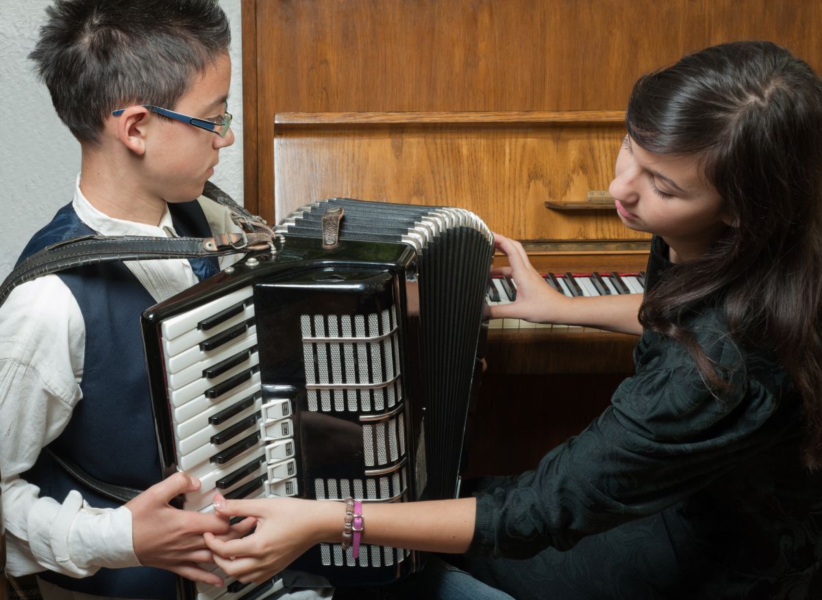 A student taking private Accordion lessons with a teacher